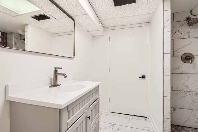 1012 E 162nd Pl, South Holland, IL 60473 - bathroom featuring vanity, marble finish flooring, a tile shower, and a drop ceiling