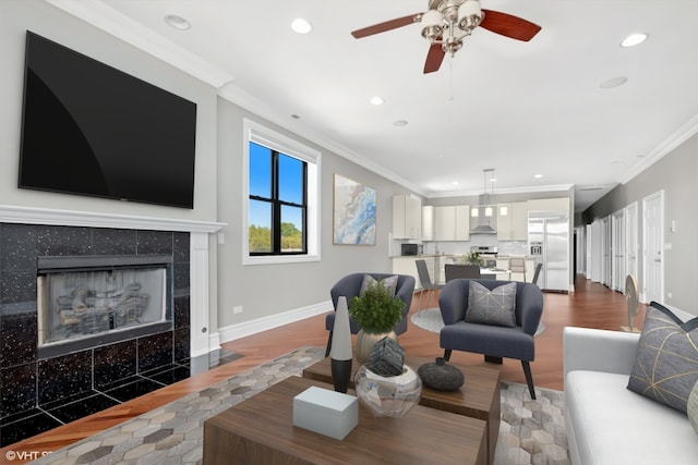 3641 N Ashland Ave Unit 4N, Chicago, IL 60613 - living room with wood finished floors, crown molding, a fireplace, a ceiling fan, and recessed lighting