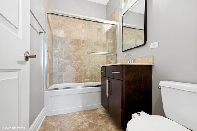 full bathroom with toilet, vanity, and shower / bath combination with glass door