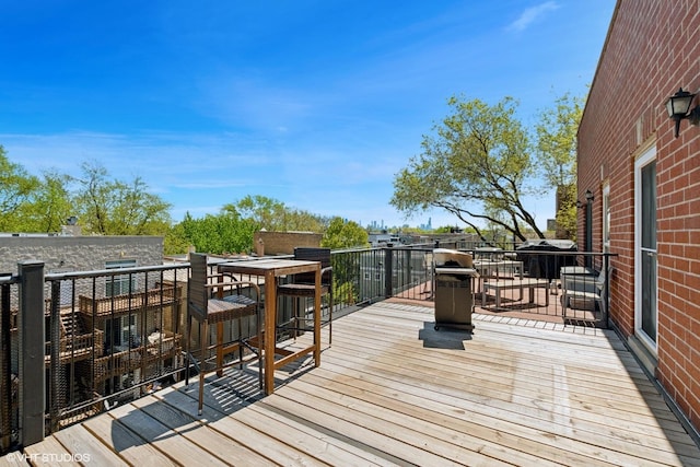 wooden deck with outdoor dining area