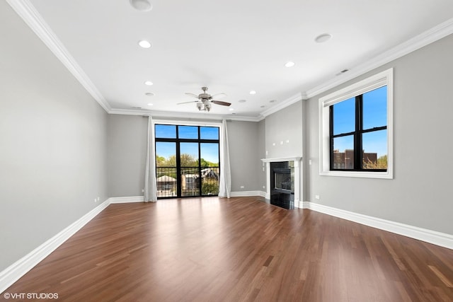 3641 N Ashland Ave Unit 4N, Chicago, IL 60613 - unfurnished living room featuring ornamental molding, wood finished floors, recessed lighting, a high end fireplace, and a ceiling fan
