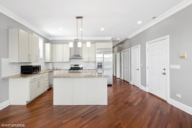 3641 N Ashland Ave Unit 4N, Chicago, IL 60613 - kitchen featuring appliances with stainless steel finishes, decorative backsplash, dark wood finished floors, a sink, and ornamental molding