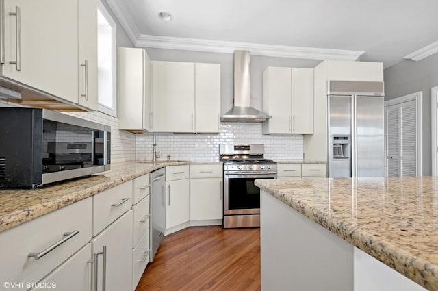 3641 N Ashland Ave Unit 4N, Chicago, IL 60613 - kitchen featuring stainless steel appliances, wall chimney exhaust hood, crown molding, tasteful backsplash, and wood finished floors