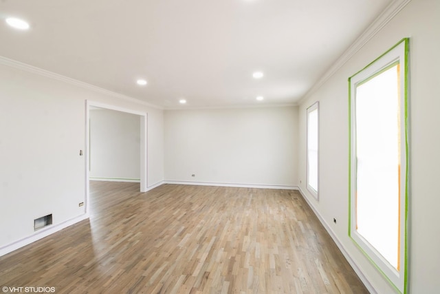 unfurnished room featuring crown molding, recessed lighting, light wood-style floors, and baseboards