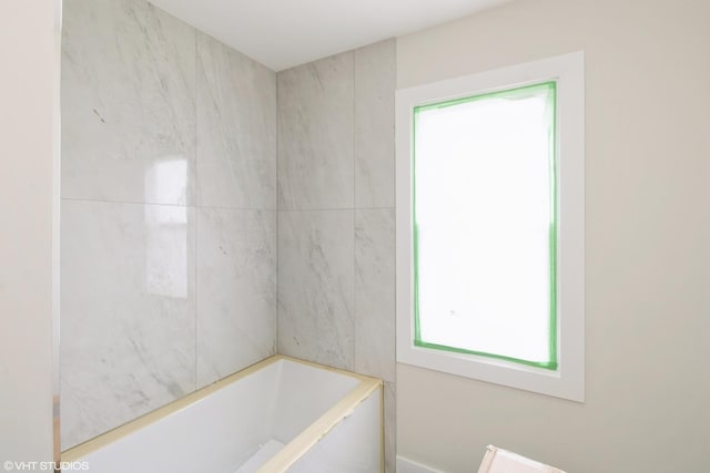 full bath featuring a bath