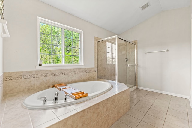 325 Hemlock Ln, West Chicago, IL 60185 - bathroom with a stall shower, tile patterned floors, a bath, and lofted ceiling