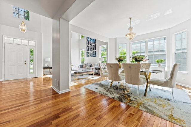 325 Hemlock Ln, West Chicago, IL 60185 - dining space featuring a chandelier, hardwood / wood-style flooring, and baseboards
