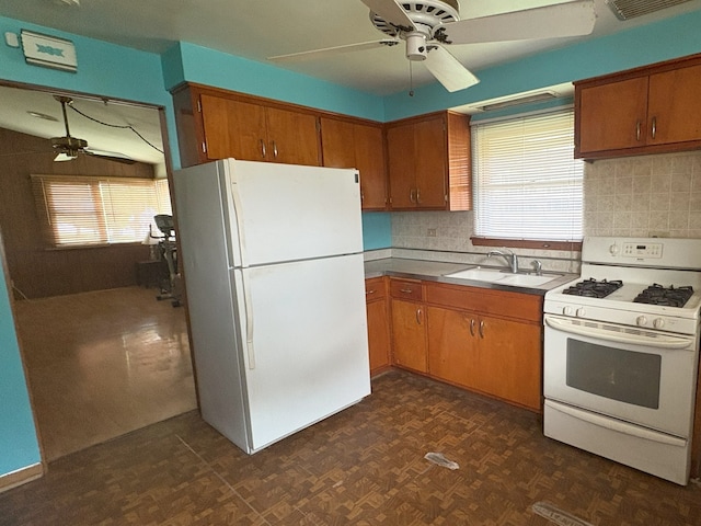 3410 Calwagner St, Franklin Park, IL 60131 - kitchen with white appliances, a sink, ceiling fan, brown cabinetry, and decorative backsplash