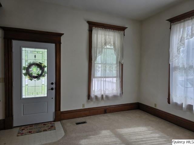 722 Wabash Ave, Carthage, IL 62321 - carpeted foyer featuring baseboards