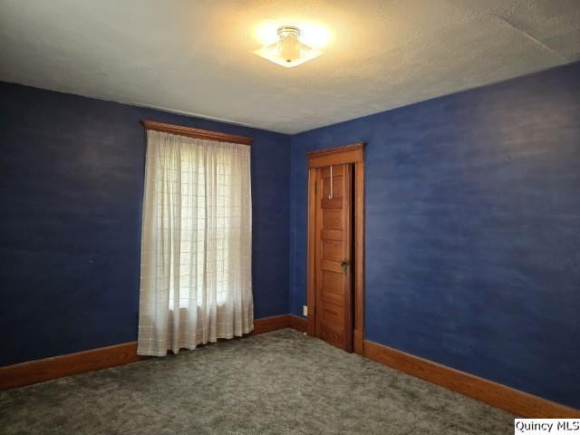 722 Wabash Ave, Carthage, IL 62321 - unfurnished room with baseboards and carpet floors