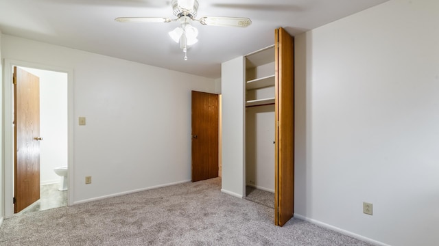 unfurnished bedroom featuring carpet floors, a closet, ceiling fan, and baseboards