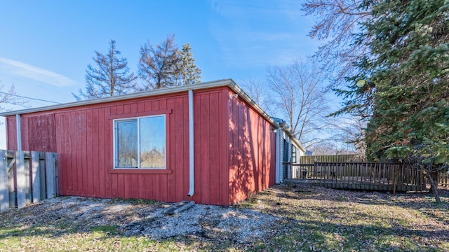 view of outbuilding with fence
