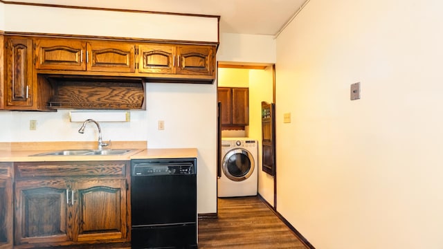 clothes washing area with washer / dryer, cabinet space, and dark wood-type flooring