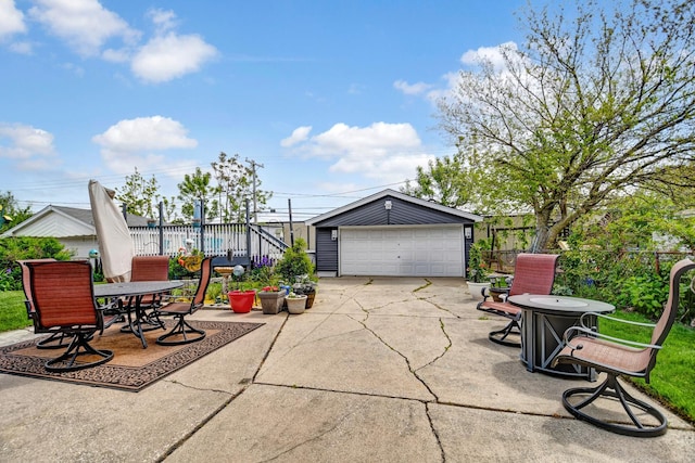 12613 S Keeler Ave, Alsip, IL 60803 - view of patio / terrace featuring a garage, an outdoor structure, and outdoor dining space