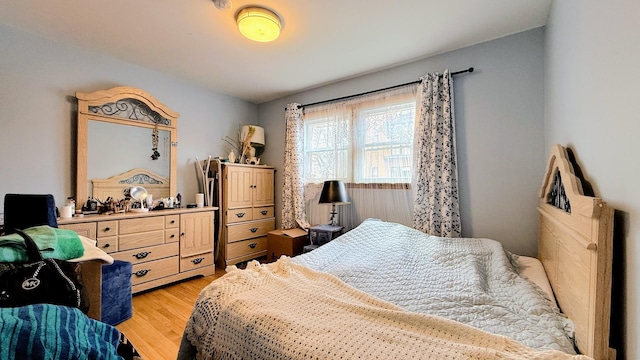 bedroom with light wood-type flooring