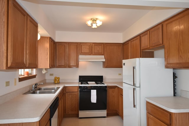 kitchen featuring white appliances, under cabinet range hood, a sink, and brown cabinets