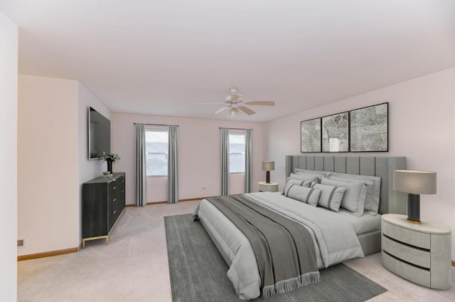 bedroom featuring light carpet, baseboards, and ceiling fan
