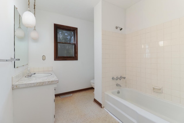311 Hillside Ln, Bloomington, IL 61701 - bathroom featuring toilet, vanity, shower / washtub combination, and baseboards