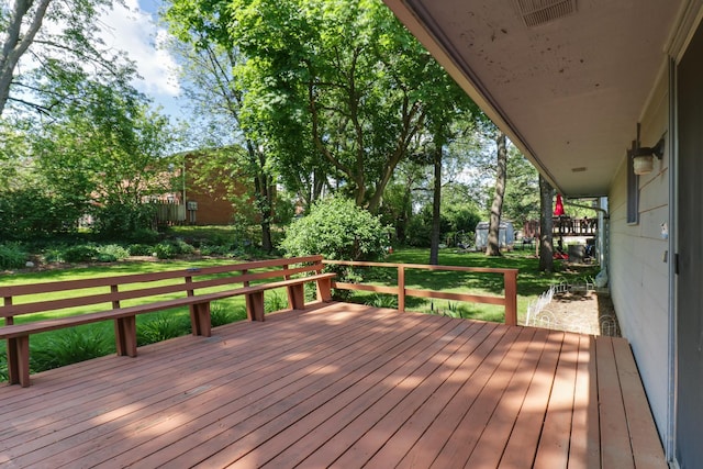 311 Hillside Ln, Bloomington, IL 61701 - deck with a lawn and view of wooded area