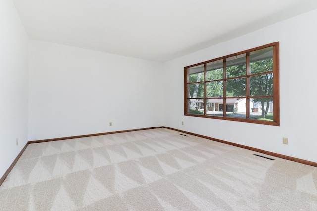 311 Hillside Ln, Bloomington, IL 61701 - carpeted spare room featuring baseboards