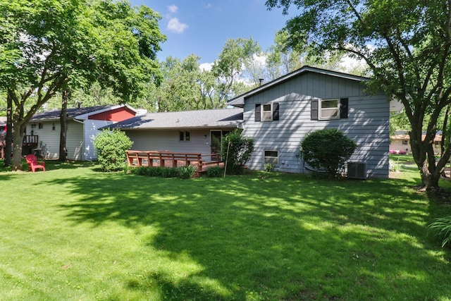 311 Hillside Ln, Bloomington, IL 61701 - back of property with a lawn and cooling unit