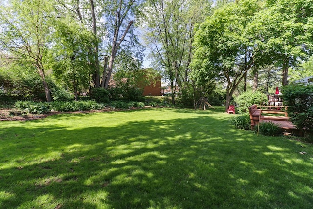 311 Hillside Ln, Bloomington, IL 61701 - view of grassy yard featuring a deck