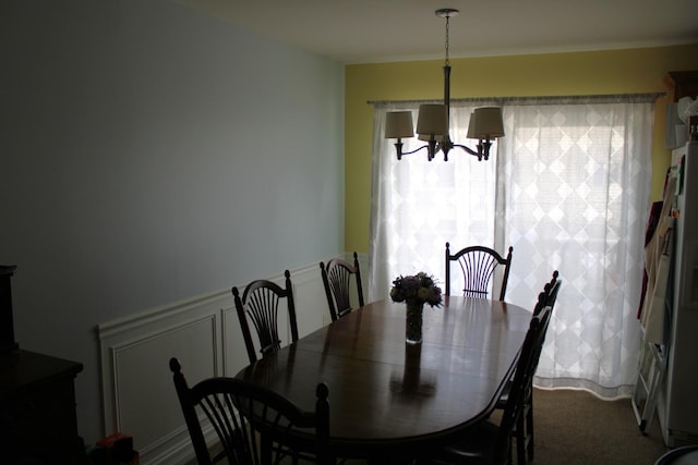 dining space featuring a chandelier