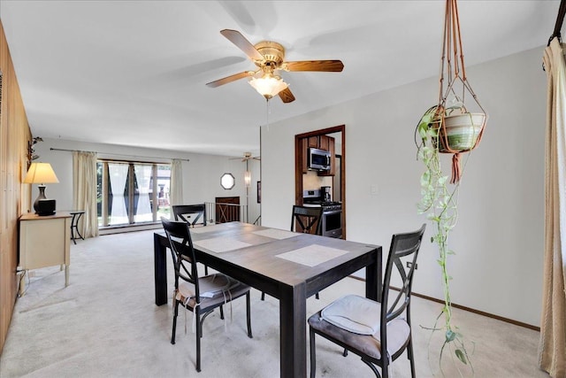 1264 N Kennedy Dr, Streamwood, IL 60107 - dining area featuring light colored carpet and ceiling fan