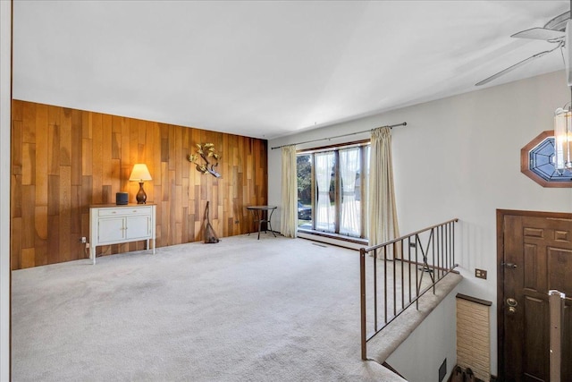 1264 N Kennedy Dr, Streamwood, IL 60107 - unfurnished living room with wooden walls and carpet
