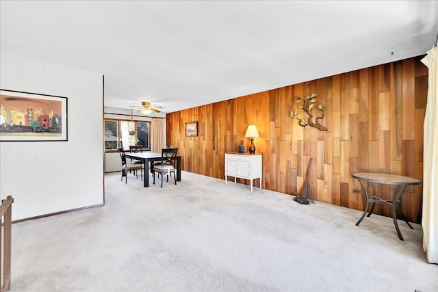 1264 N Kennedy Dr, Streamwood, IL 60107 - carpeted dining space featuring wood walls and a ceiling fan