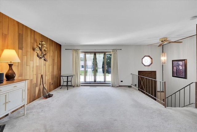 1264 N Kennedy Dr, Streamwood, IL 60107 - living room with carpet flooring, wooden walls, and ceiling fan