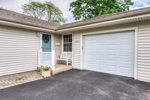 1408 E Evergreen St, Wheaton, IL 60187 - property entrance featuring driveway, an attached garage, and a shingled roof