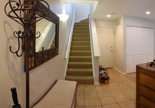 stairs featuring recessed lighting, tile patterned floors, and baseboards