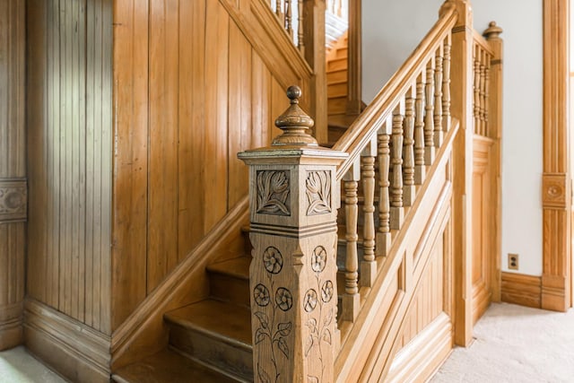 706 Washington Ave, Dixon, IL 61021 - stairs featuring wood walls and carpet floors