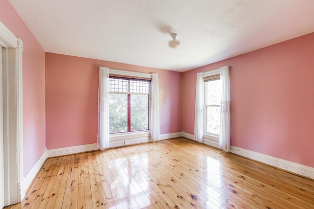 706 Washington Ave, Dixon, IL 61021 - spare room with baseboards and wood-type flooring