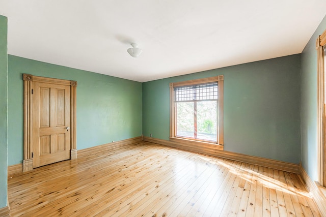 706 Washington Ave, Dixon, IL 61021 - unfurnished room with wood-type flooring and baseboards