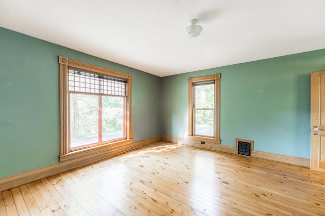 706 Washington Ave, Dixon, IL 61021 - spare room featuring hardwood / wood-style flooring and baseboards