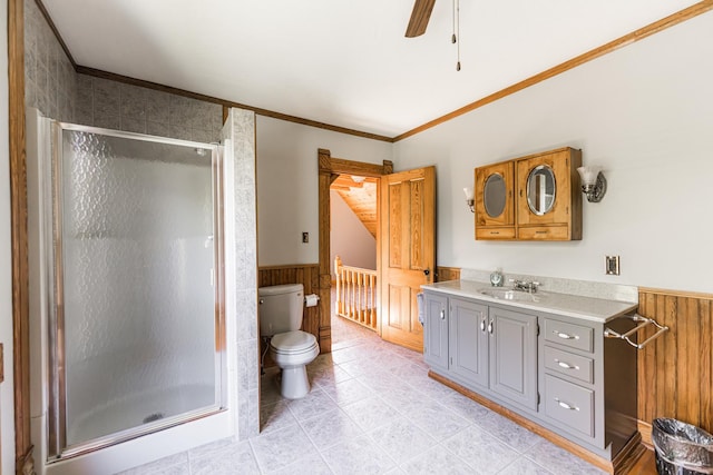 706 Washington Ave, Dixon, IL 61021 - bathroom featuring wainscoting, toilet, vanity, a stall shower, and crown molding