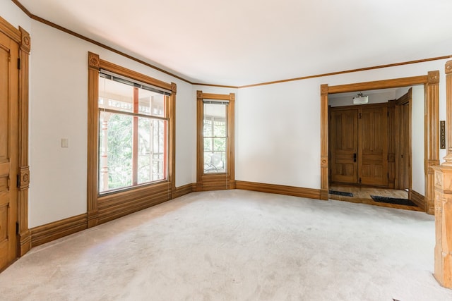 706 Washington Ave, Dixon, IL 61021 - carpeted spare room with ornamental molding and baseboards