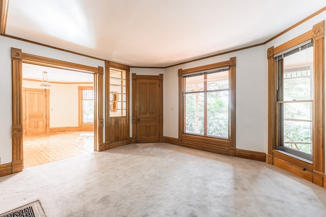 706 Washington Ave, Dixon, IL 61021 - carpeted foyer entrance with ornamental molding and baseboards
