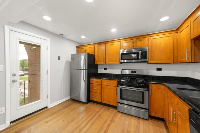 6758 W 64th Pl Unit 13, Chicago, IL 60638 - kitchen with stainless steel appliances, brown cabinetry, light wood-style flooring, recessed lighting, and baseboards