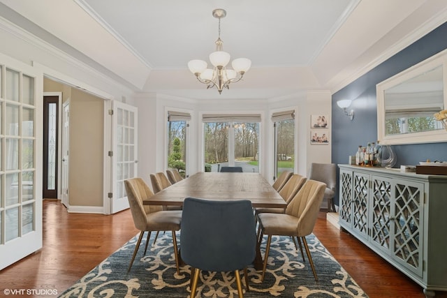 122 Ravine Ln, Barrington, IL 60010 - dining area with a chandelier, a raised ceiling, wood finished floors, and crown molding