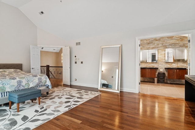 122 Ravine Ln, Barrington, IL 60010 - bedroom featuring wood finished floors, baseboards, high vaulted ceiling, and connected bathroom