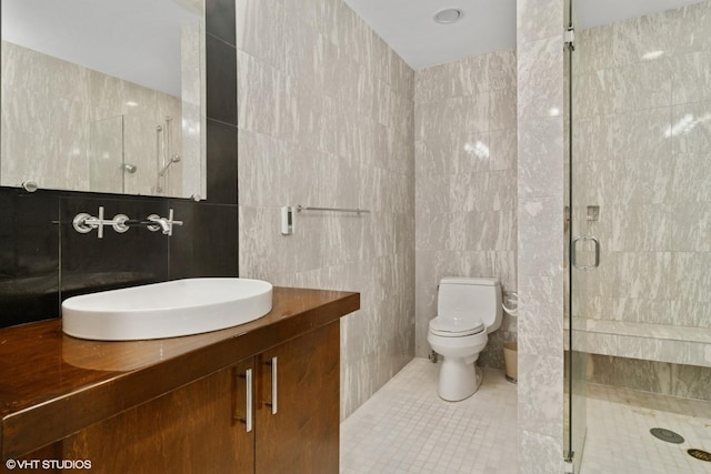 122 Ravine Ln, Barrington, IL 60010 - bathroom featuring tile walls, a stall shower, toilet, vanity, and tile patterned flooring