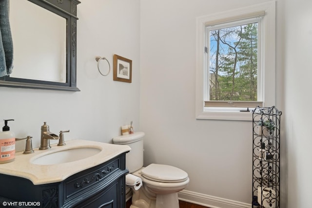 122 Ravine Ln, Barrington, IL 60010 - half bath featuring toilet, vanity, and baseboards