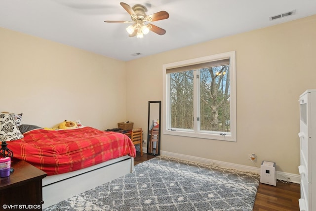 122 Ravine Ln, Barrington, IL 60010 - bedroom featuring baseboards, wood finished floors, and a ceiling fan