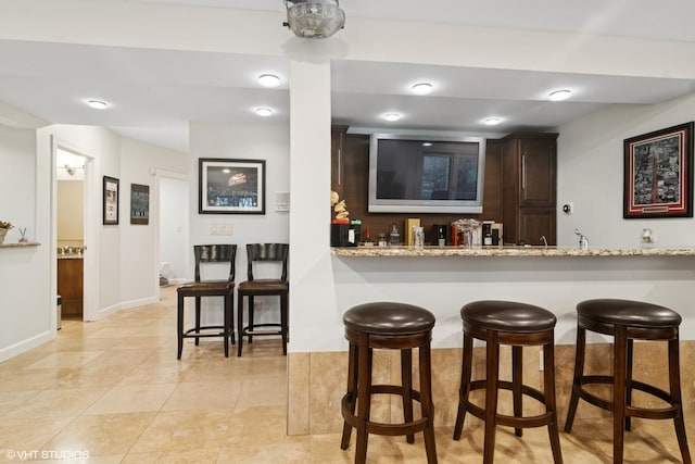 122 Ravine Ln, Barrington, IL 60010 - indoor wet bar featuring baseboards and light tile patterned flooring