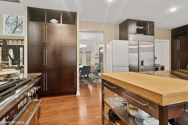 122 Ravine Ln, Barrington, IL 60010 - kitchen with premium appliances, light wood-style flooring, a chandelier, healthy amount of natural light, and recessed lighting