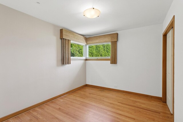 6956 Seward St, Niles, IL 60714 - unfurnished bedroom featuring light wood finished floors and baseboards