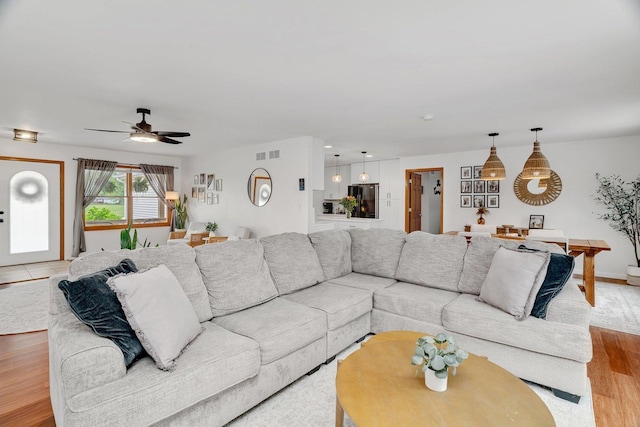 817 W 3rd St, Braidwood, IL 60408 - living area with ceiling fan and light wood-style floors